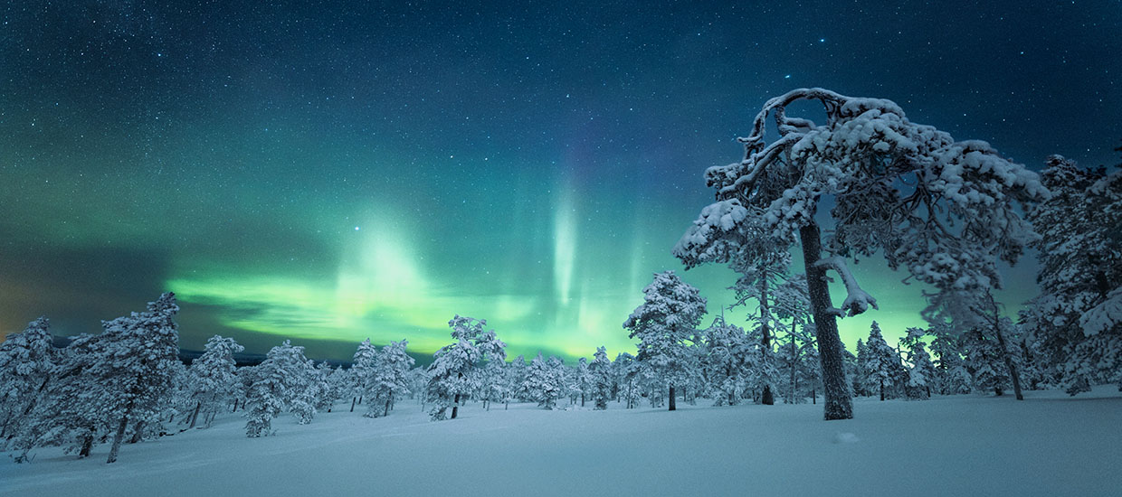 An aurora in Lapland, Finland. Stock image from Unsplash.